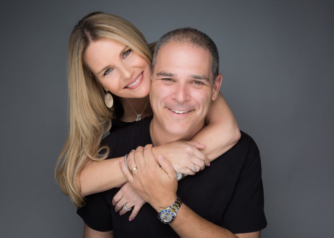 Portrait of a wife hugging her husband in Fort Lauderdale