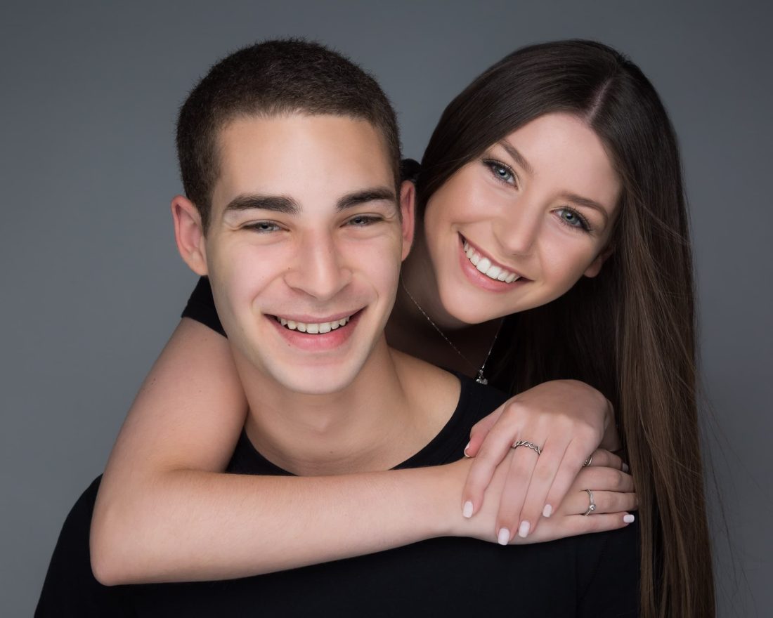 Photo of a sister hugging her brother in Fort Lauderdale