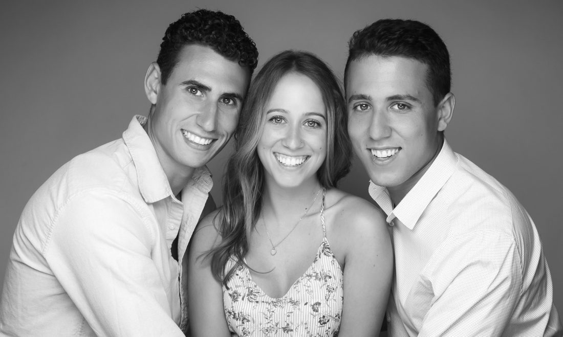 Black and white portrait of two brothers a sister in South Florida